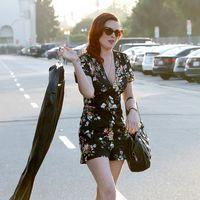 Rumer Willis exits Neil George Salon carrying a garment bag